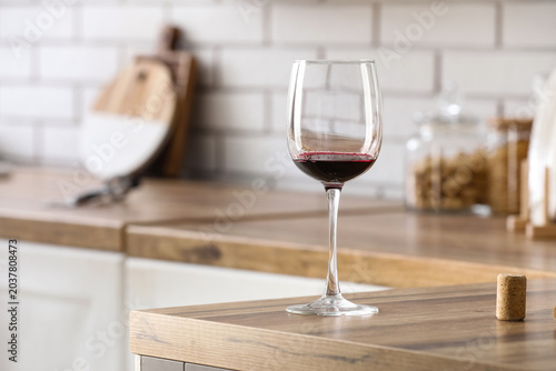 Glass of red wine on counte...