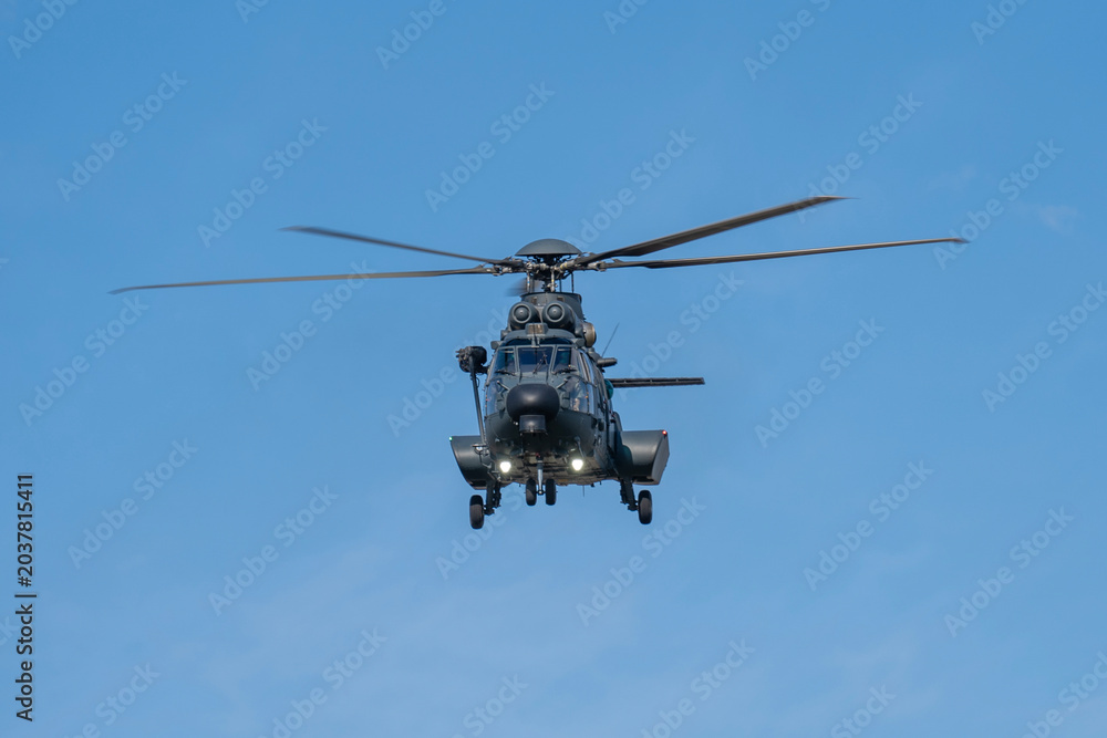Fototapeta premium Black painted modern military transport helicopter in Hungary