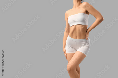 Young woman in underwear on...