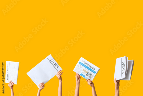 Female hands with newspaper...