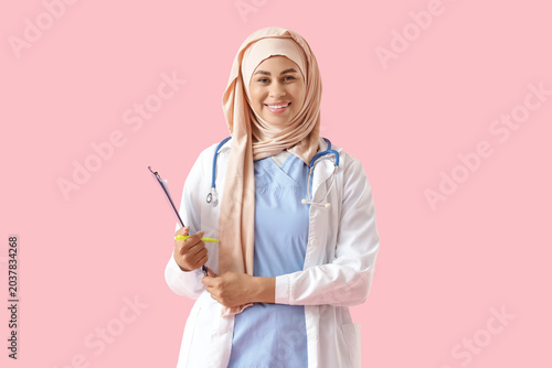 Smiling Muslim female docto...