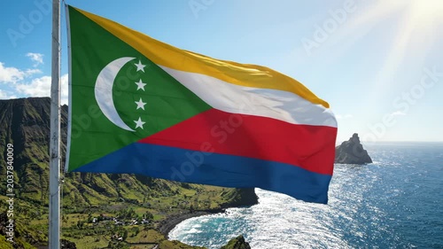 Comoros flag waving by the sea