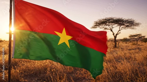 Flag of Burkina Faso in a savanna landscape