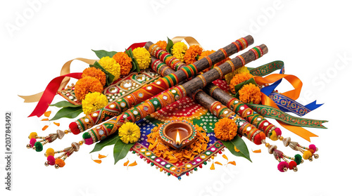 Dandiya sticks with marigold flowers and diya isolated on transparent background
