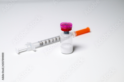 Peptides and syringe. Peptides are amino acids that are used in a myriad of medical ways from glucose control to battling inflammation.