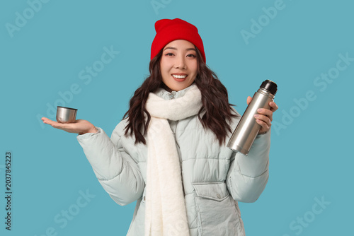 Young Asian woman in winter...