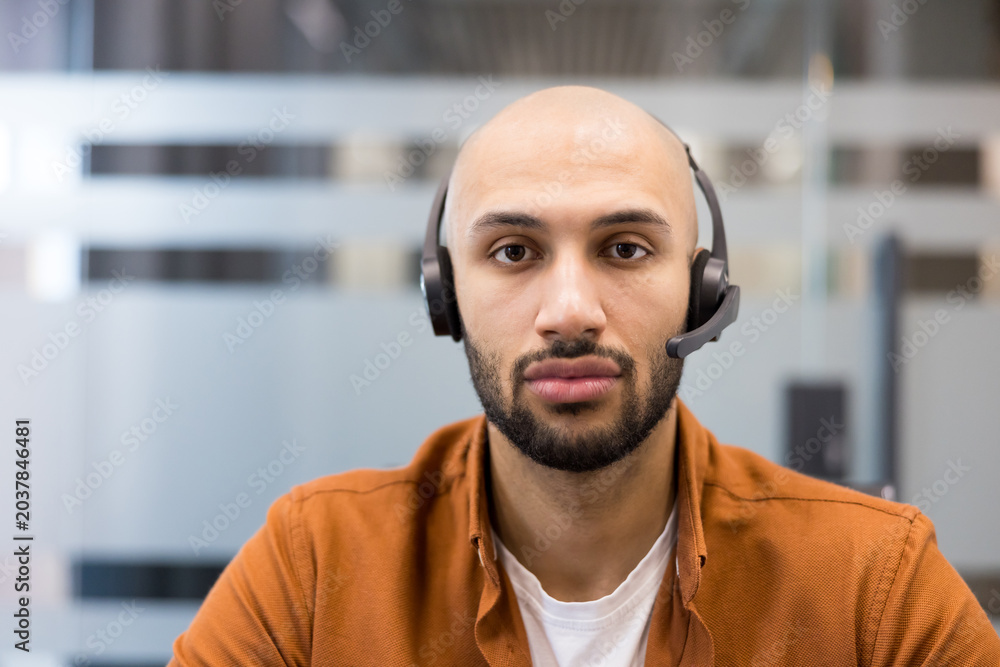 Fototapeta premium Customer service agent wearing headset providing online support