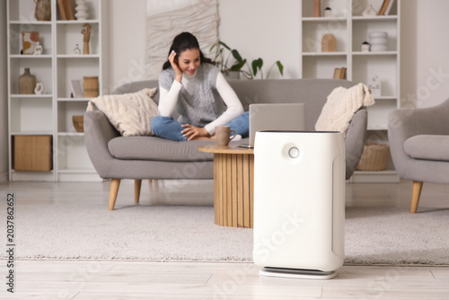 Air purifier against woman ...