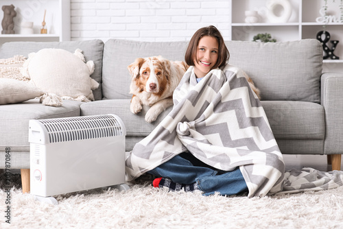 Young woman with blanket an...