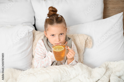 Sick little girl with sore ...