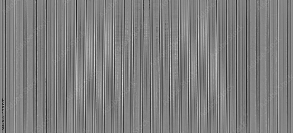 Fototapeta premium Abstract seamless industrial corrugated silver metal sheet texture with a gray and white striped pattern backdrop