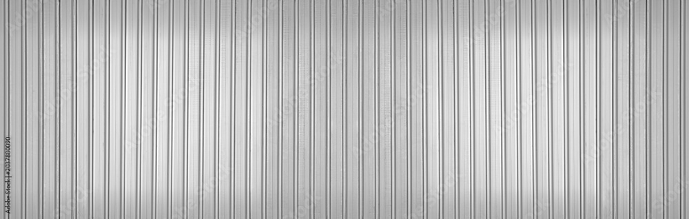 Abstract seamless industrial corrugated silver metal sheet texture with a gray and white striped pattern backdrop