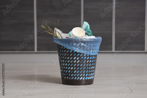 Trash bin full of garbage i...