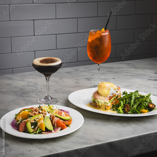 Avocado toast, salad, espresso martini and Aperol Spritz