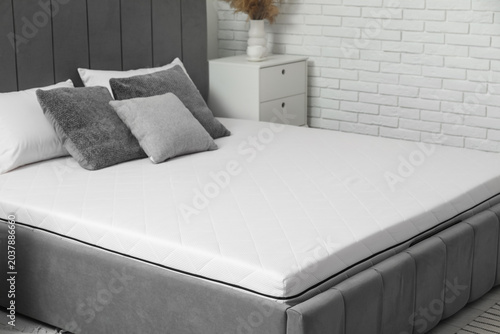 Bilde på lerret New orthopedic mattress on stylish bed in room, closeup