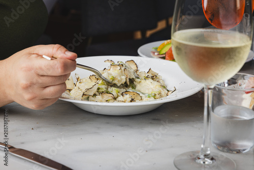 man eating truffle risotto