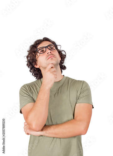 Εκτύπωση καμβά Pensive young man keeps hand under chin, thoughtful gesture, looking up focused, thinking of genial ideas, making the right choice concept