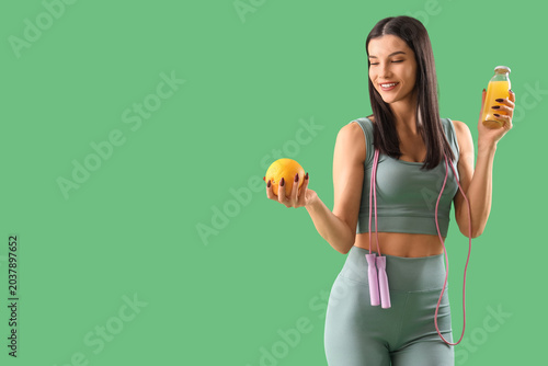 Sporty young woman with ski...