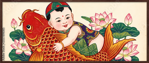 Traditional Chinese New Year painting of a cute baby riding on a big red koi fish among lotus flowers