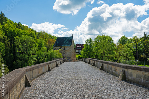 old stone bridge over the river Werra and liborius chapel near Creuzburg in Thuringia in Germany