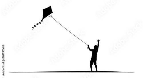 Silhouette of a young boy flying a kite in the sky.