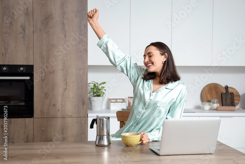Cheerful young woman with g...