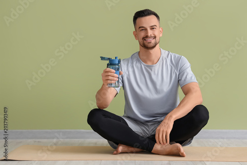 Handsome man with water bot...