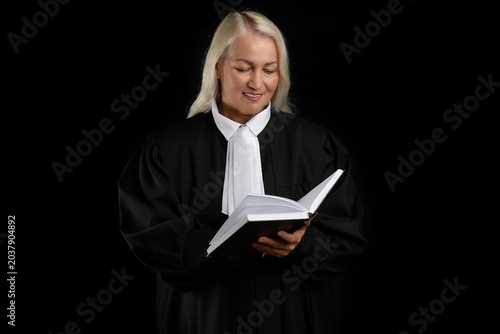 Mature female judge with bo...