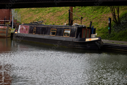Foto Canal landscape with boat and bridge