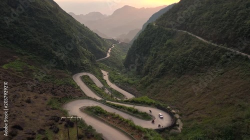 Aerial View Of the Winding Tham Ma Mountain Pass In Ha Giang Province In Vietnam - Ha Giang Loop Drone Shot at Sunset.