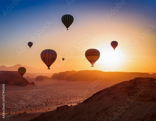 hot air balloons floating over a desert landscape at dawn capturing the beauty of a unique travel experience