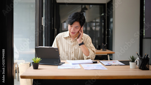 Business people communicate via mobile phones.
