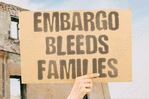 Tablou pe pânză "Embargo Bleeds Families" Trade restrictions drain household resources of ordinary citizens