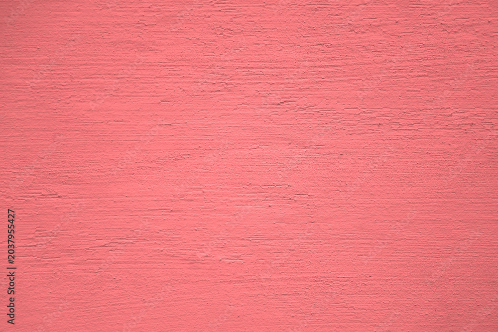 Fototapeta premium pink violet red stucco wall texture, peach fuzz color background. Abstract artistic backdrop for design. color, pastel orange plaster, exterior wall building texture pattern