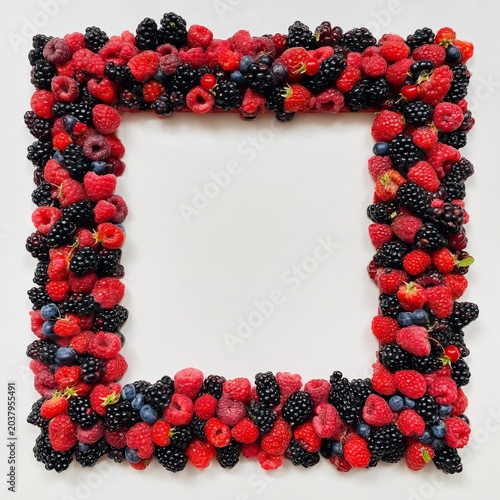 Berry Arrangement Forms a Square Shape on a Light Background During the Daytime