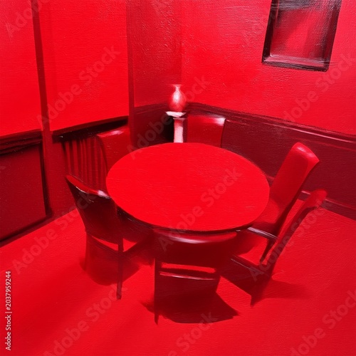 Round Table and Chairs in a Red Room With a Window During the Day