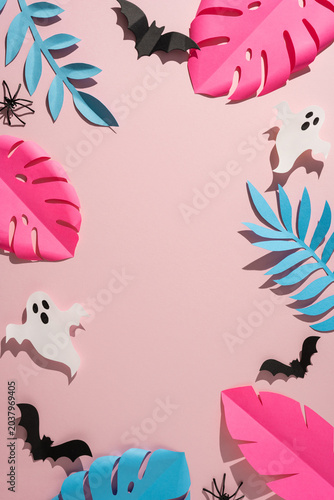 Tropical Halloween vertical paper decorations with pink monstera leaves ghosts and bats for summer party decor