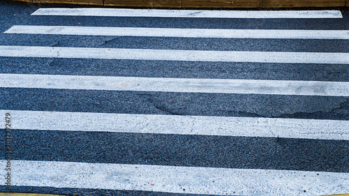 Cuadro en lienzo Urban asphalt road with clearly marked pedestrian crosswalks, creating a safe ar