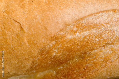 Quadro su tela Close-up full frame texture of a golden brown well-baked crispy bread crust