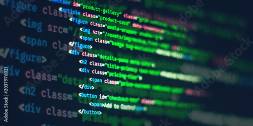 Foto Blurred HTML and CSS web development syntax code displayed on a computer screen