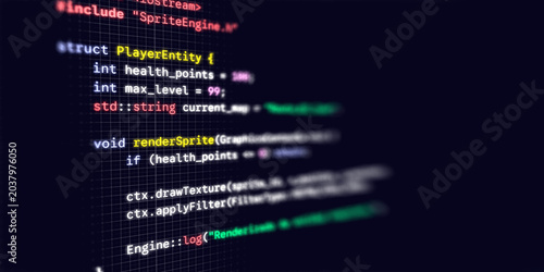 Vászonkép Macro photograph of a dark computer monitor displaying C game development code w