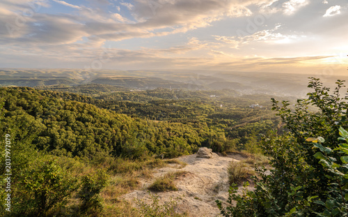 View of the mountains and Kislovodsk from the observation decks of the Kislovodsk Park. Evening sunset over the mountains of Kislovodsk.