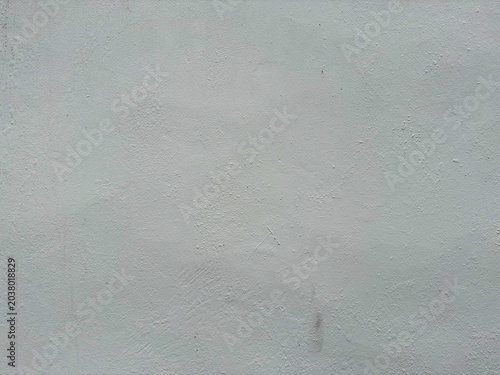 Muted gray plaster wall featuring a delicate rough texture and subtle tonal imperfections