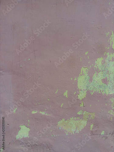Muted mauve surface revealing weathered lime green remnants and aged texture