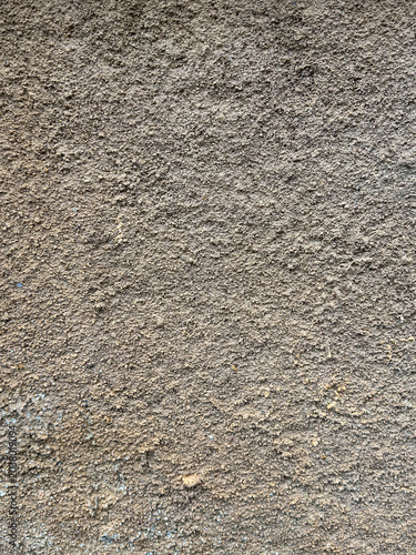 Rustic granular exterior showcasing intricate weathered surface patterns and natural tones