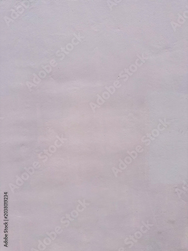 Subtle Pastel Hued Plaster Surface Featuring Delicate Textural Variations for a Calm Backdrop