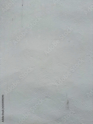 Subtle undulations on a pale facade showcasing minimal surface variations and soft diffused light