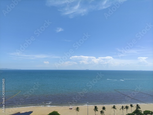 Serene Beach Landscape with Calm Ocean Waters and Clear Blue Sky