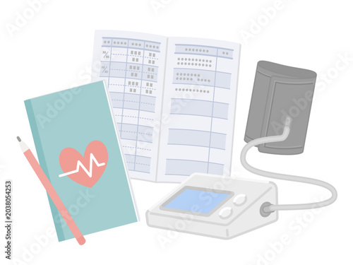 Blood pressure monitor and health record notebook with pen
