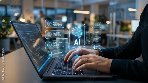 Professional working on laptop with advanced AI holographic interface, showcasing modern artificial intelligence development and data analytics in a high-tech office environment